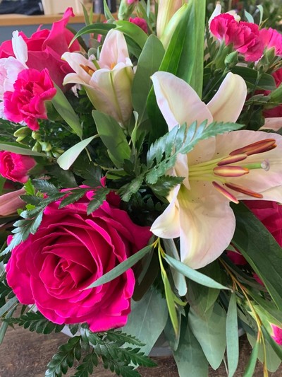 Pink rose and lily funeral posy