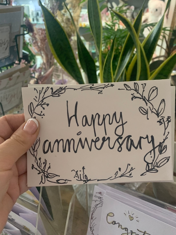 Happy anniversary card and flowers