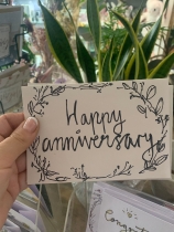 Happy anniversary card and flowers