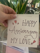 Happy anniversary card and flowers