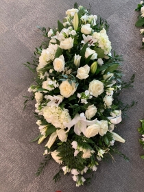 White and green stunning casket tribute