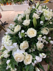 White and green stunning casket tribute